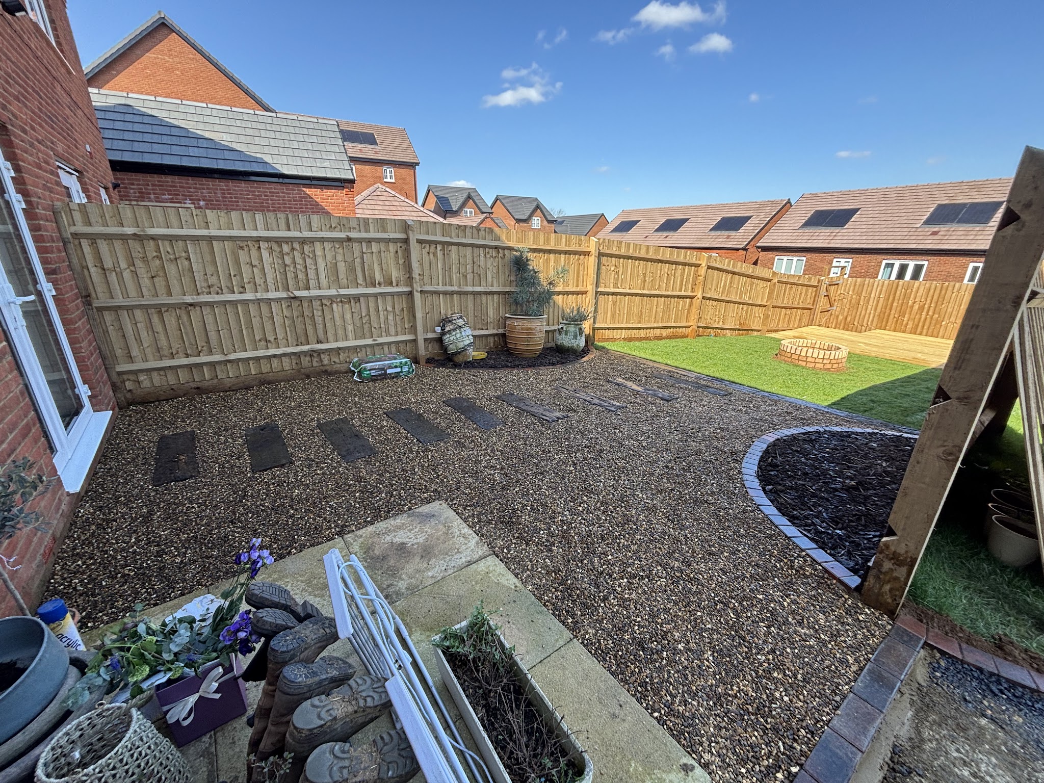 New timber fence around a gravel garden with stepping stones